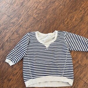 Two shirts; Victoria’s Secret Secret striped sweatshirt and Cali crop top